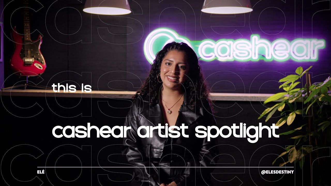 Elé smiling in a black leather jacket and hoop earrings on the Artist Spotlight set