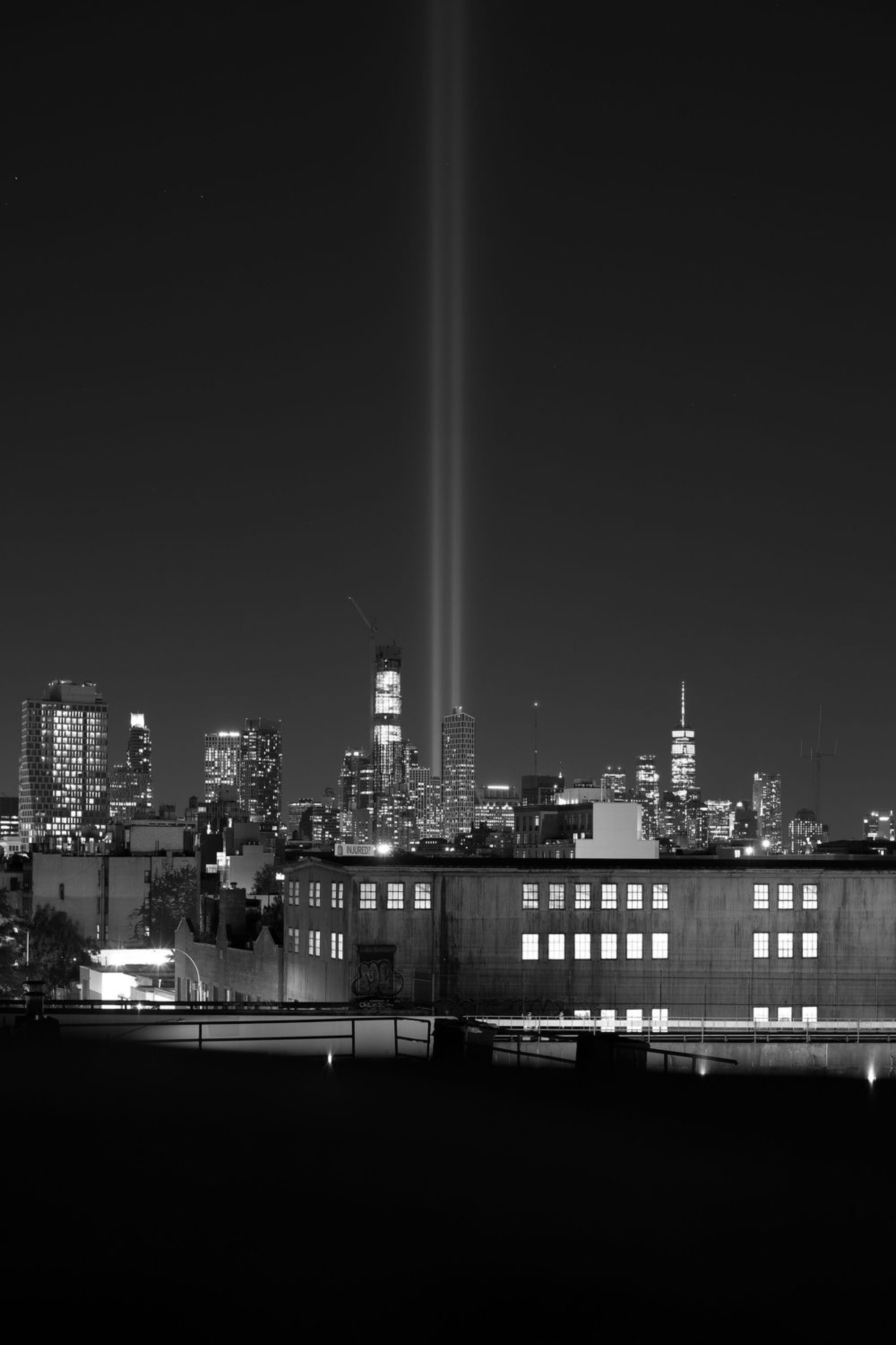 Twin beams of the September 11 tribute lights over the New York City skyline at night