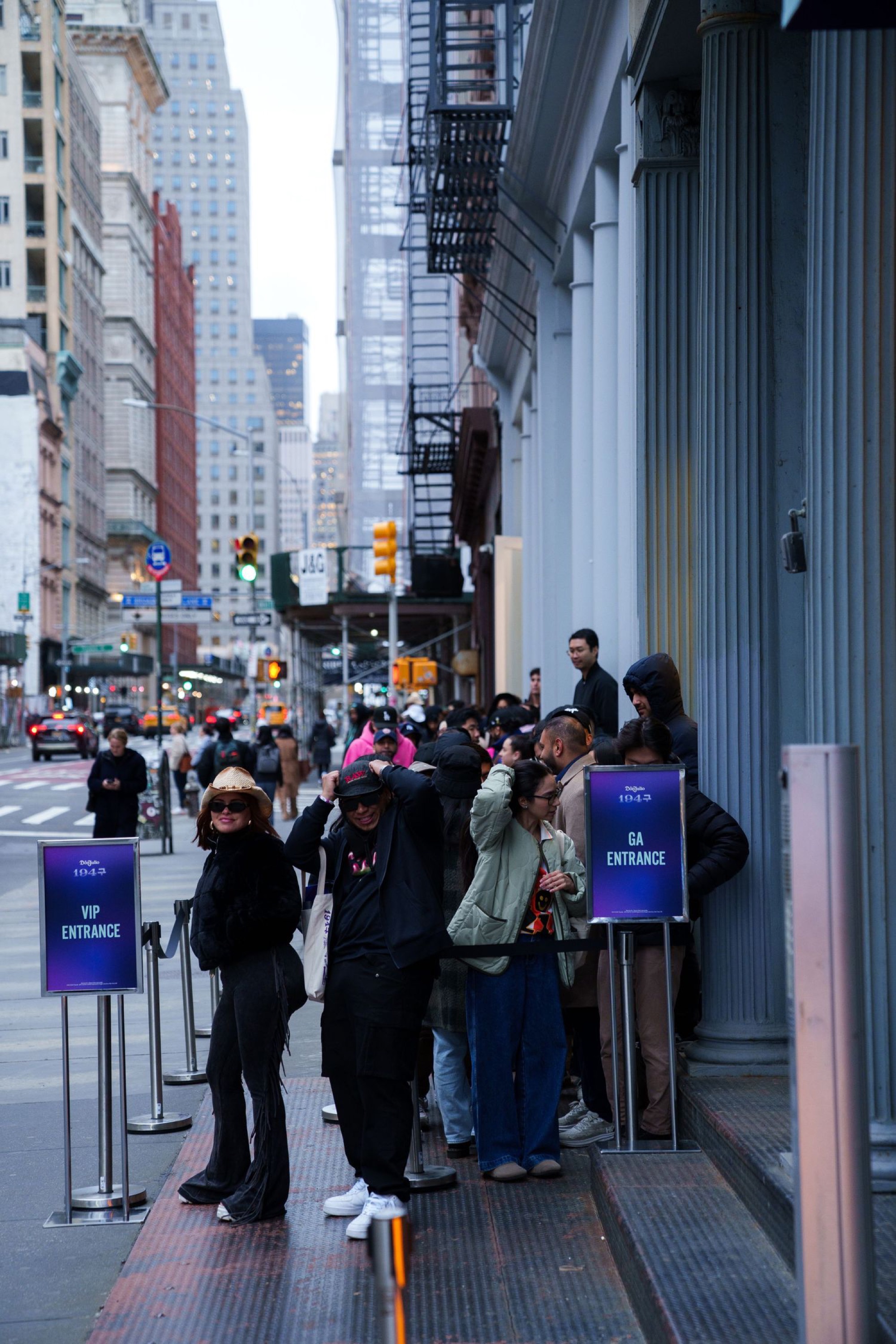 A queue of guests waits outside the Gouvenirs storefront takeover in Tribeca, beside VIP Entrance and GA Entrance signs