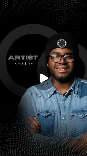 Kyle Bethel in a denim shirt and beanie, arms crossed on the Artist Spotlight vertical cover