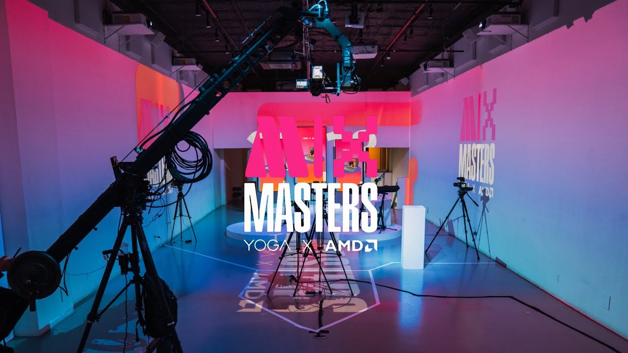 Camera jib and tripods around the Mix Masters stage under pink and blue gradient lighting
