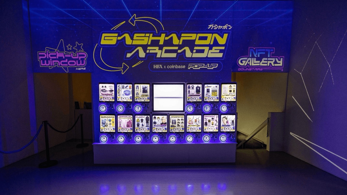 Gashapon Arcade wall of glowing capsule machines at the HBX x Coinbase pop up