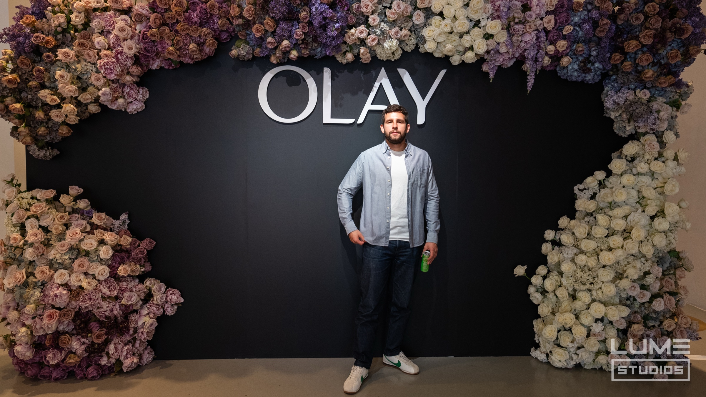 Olay fearless beach lounge with rattan chair, sandcastles, and coconut cups at Lume Studios