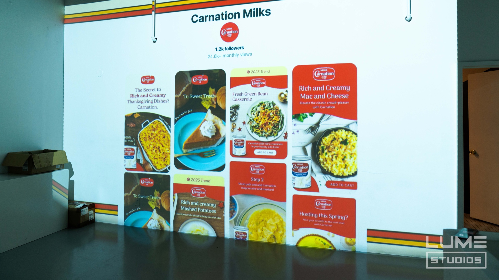 Carnation Milks Pinterest board with holiday recipes fills a projected gallery wall