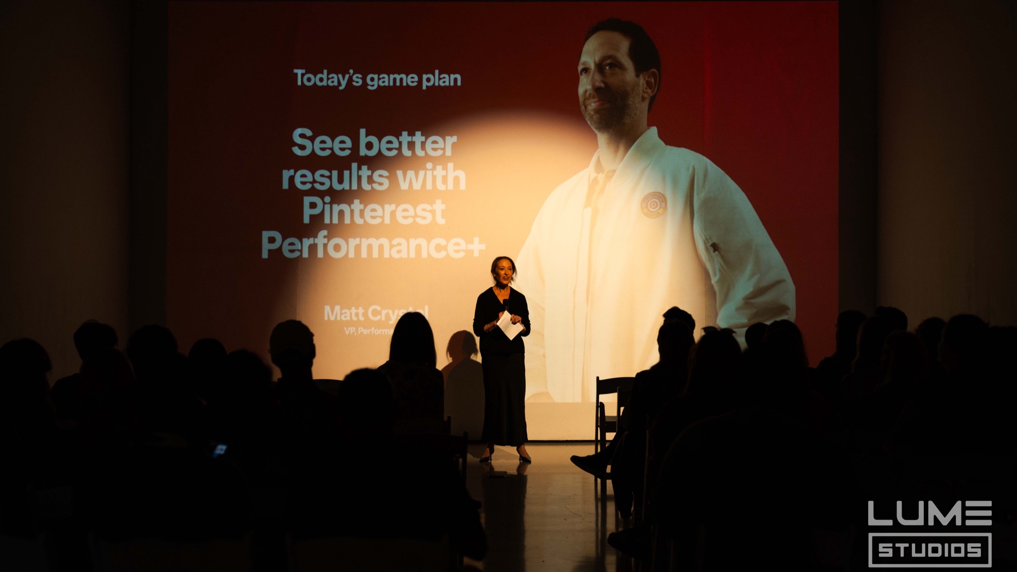 Presenter addresses the audience before a red Pinterest Performance+ slide at Lume Studios